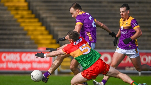 Jonathan Bealin scored Wexford's second goal despite the efforts of Mikey Bambrick