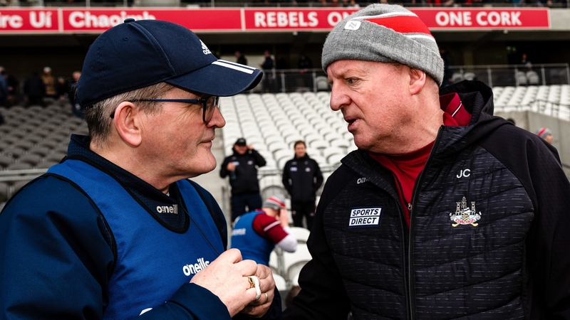 Cork manager John Cleary in conversation with Limerick manager Jimmy Lee after today's game