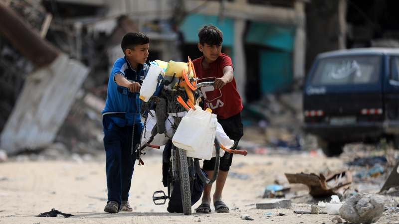 Palestinian families return to their houses left amid rubble after Israeli forces' withdrawal from Khan Yunis