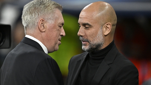 Real Madrid manager Carlo Ancelotti (L) and Man City boss Pep Guardiola