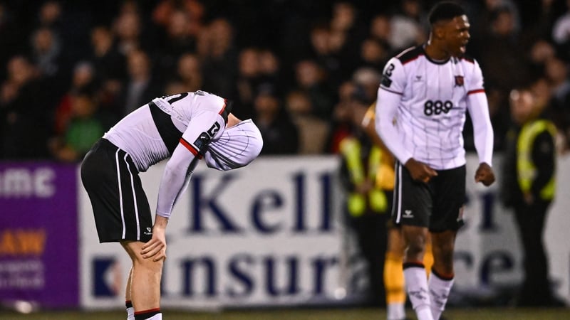 Dundalk players Zak Bradshaw and Mayowa Animasahun react after the final whistle