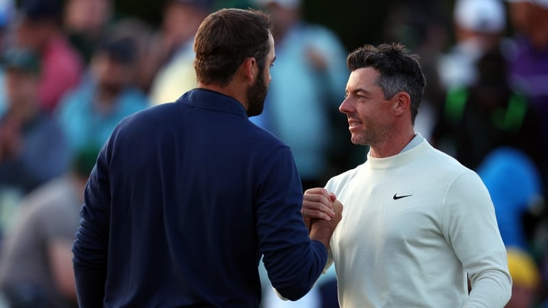Rory McIlroy shakes hands with Scottie Scheffler after contrasting second rounds at Augusta National
