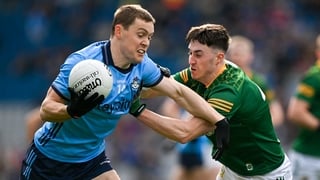 Con O'Callaghan (L) holds off Harry O'Higgins