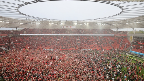 Fans of Bayer Leverkusen celebrate their first Bundesliga title