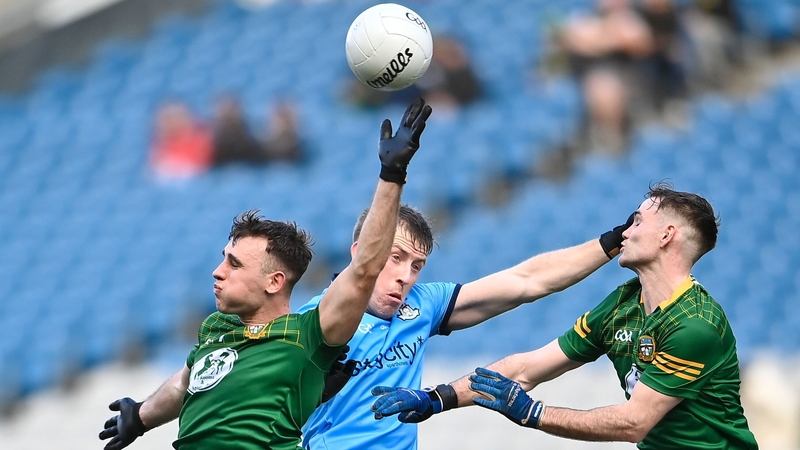 Seán Coffey of Meath battles for possession with Seán Bugler