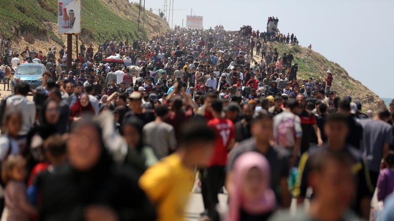 Displaced Palestinians pictured taking the coastal Al-Rashid road as they try to return to Gaza city