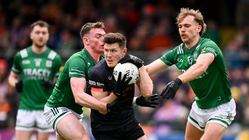 Joe McElroy of Armagh in action against Oisin Smyth, left, and Ultán Kelm
