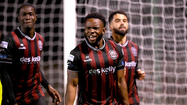 James Akintunde (C) celebrates his late winning goal for Bohemians
