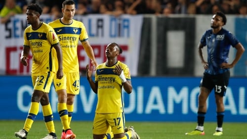 Tijjani Noslin (#17) of Verona collapses to his knees at the final whistle