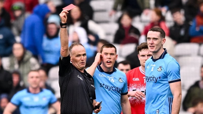 Conor Lane flashing the red card at Brian Fenton