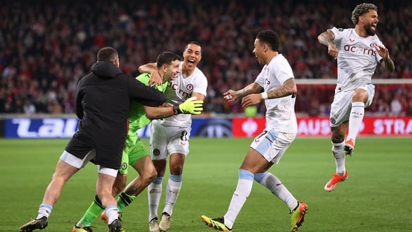 Aston Villa players mob Emiliano Martinez after their shootout success