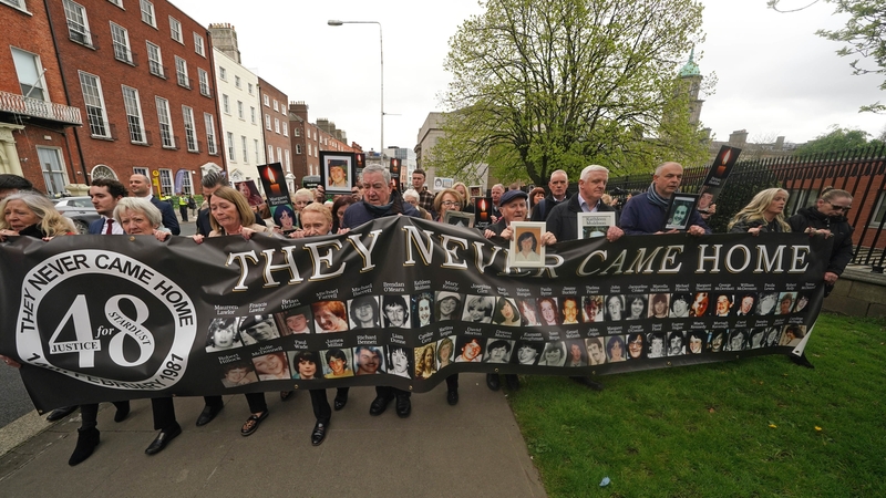 Family members of the Stardust victims walk to the Garden of Remembrance after the verdict of unlawful killing was returned by the jury