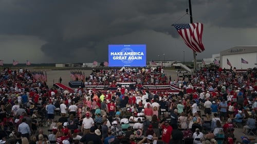 Attendees wait prior to a campaign rally with Donald Trump at the Aero Center Wilmington in Wilmington, North Carolina