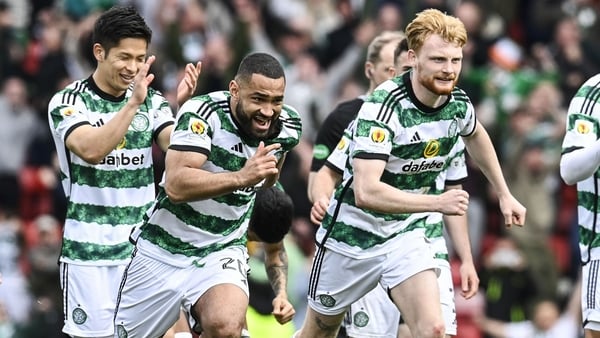 Liam Scales (R) celebrates Celtic's shootout victory alongside Cameron Carter-Vickers