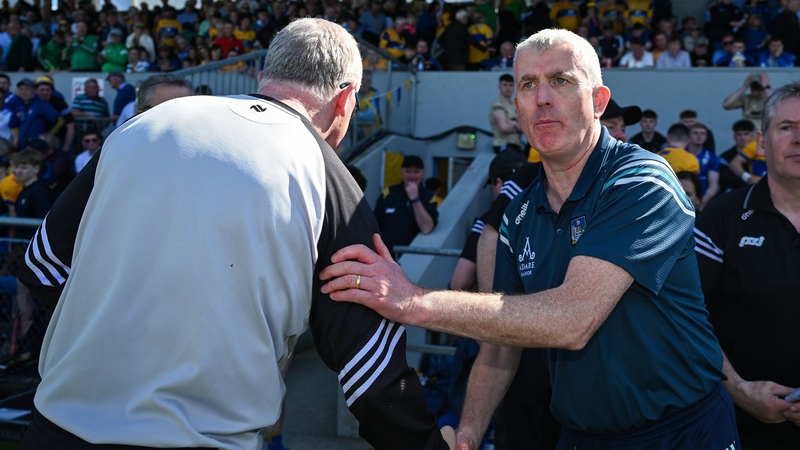 Brian Lohan and John Kiely shake hands at full-time in Ennis