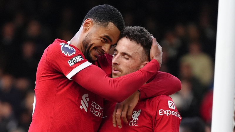 Diogo Jota celebrates scoring his team's third with Cody Gakpo