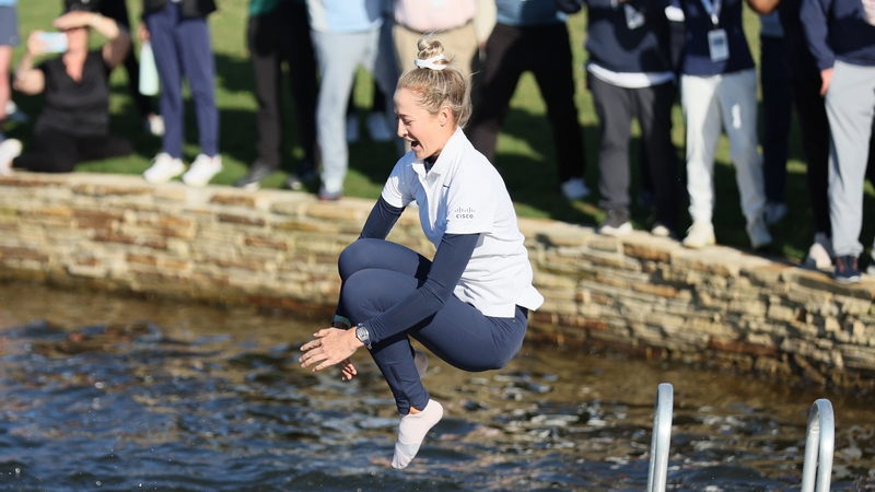 Nelly Korda jumps into the water after her win