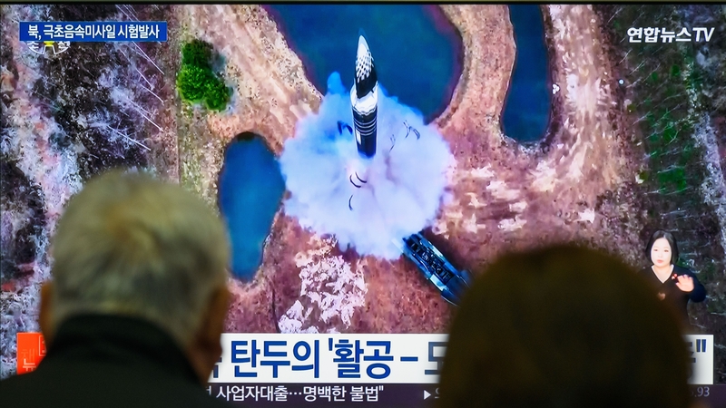 A public television screen in South Korea showing images of a previous North Korean missile launch