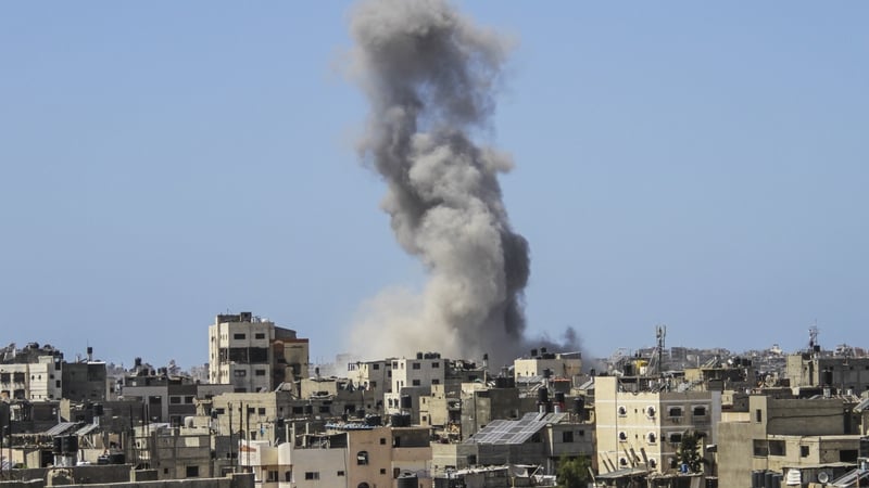 Smoke rises after an Israeli airstrike on Al-Saftawi area of northern Gaza city