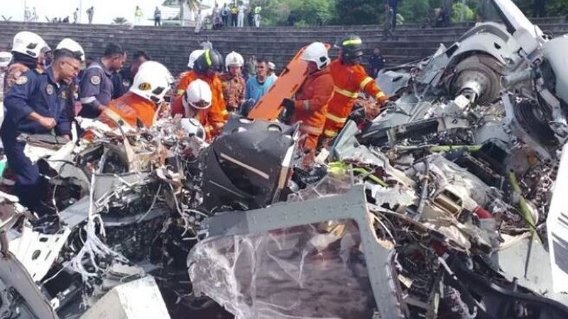 Emergency personnel work at the site of a helicopter crash in Lumut, Perak, Malaysia (Pics: Fire and Rescue Department of Malaysia)