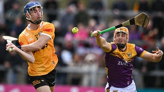 James McNaughton of Antrim in action against Damien Reck of Wexford