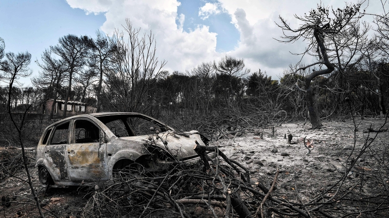 The wreckage of a car at the seaside resort of Mati in July 2018