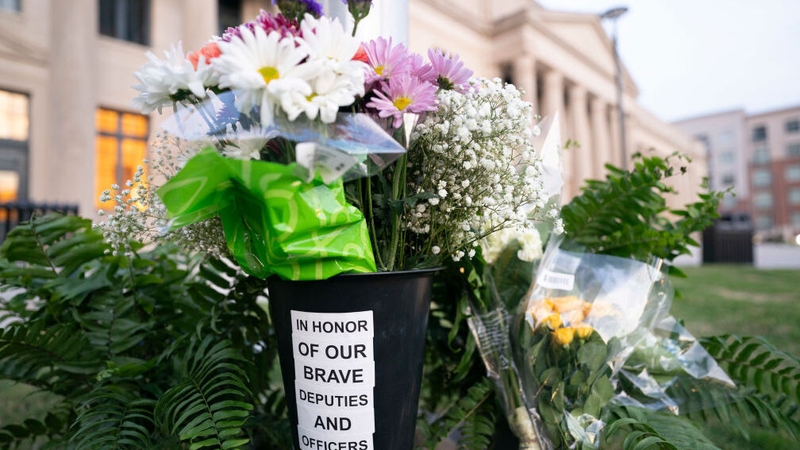 Flowers left at the scene of the shooting in Charlotte