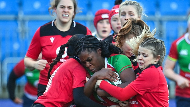 Faith Oviawe (c) of Clovers in action against Brython Thunder