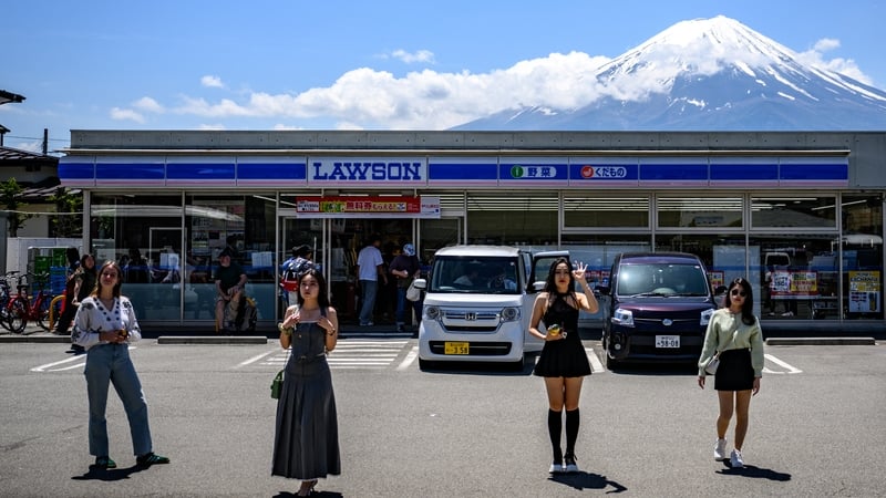 Fujikawaguchiko town began building panels of mesh netting at a spot where unending flows of mostly foreign tourists visit daily to take photos of the mountain
