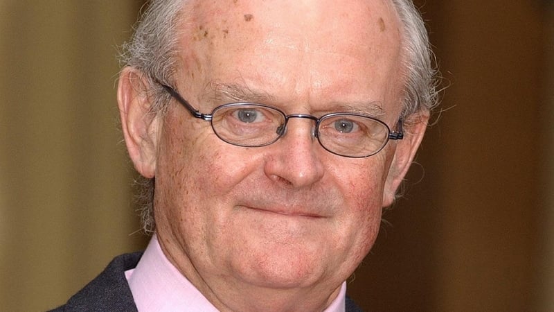 Bruce Arnold received an OBE at Buckingham Palace in 2003