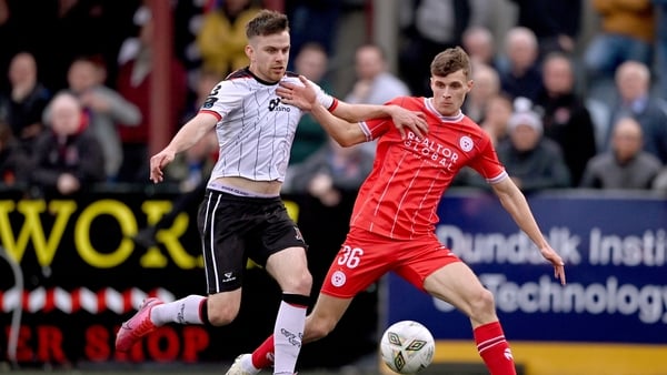 Will Jarvis of Shelbourne in action against Archie Davies of Dundalk