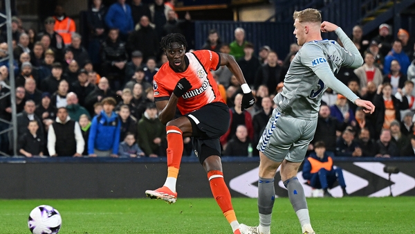 Elijah Adebayo with Luton's leveller
