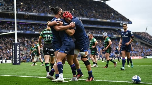 James Lowe celebrates with Jamison Gibson-Park and Josh van der Flier after scoring the opening try