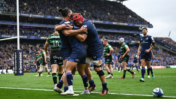 James Lowe celebrates with Jamison Gibson-Park and Josh van der Flier after scoring the opening try