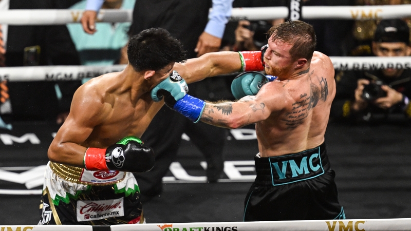 Canelo Alvarez (right) retained his WBC, WBO, IBF and WBA super middleweight titles