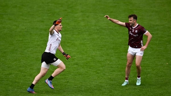 Galway goalkeeper Connor Gleeson is congratulated by team-mate Paul Conroy after his winning score