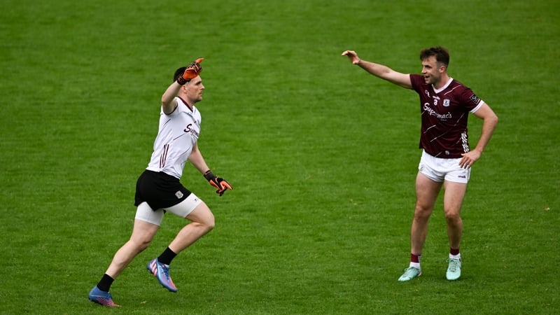Galway goalkeeper Connor Gleeson is congratulated by team-mate Paul Conroy after his winning score