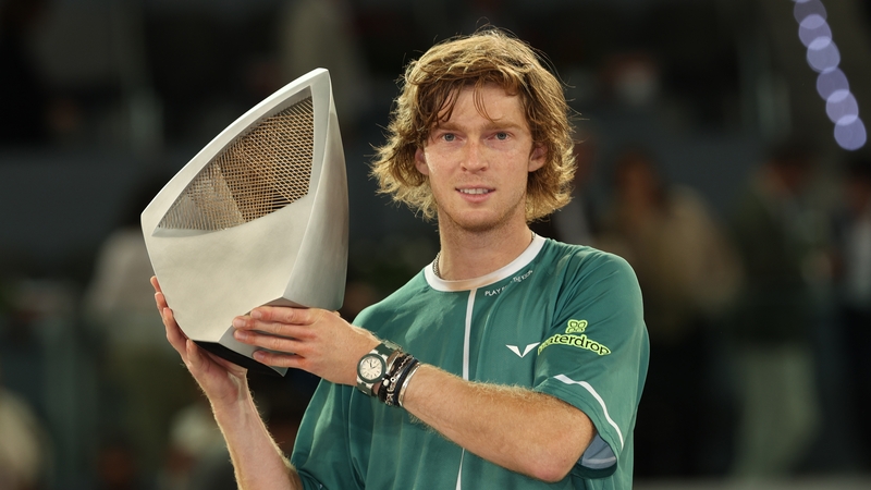 Andrey Rublev lifts the Mutua Madrid Open trophy following victory in the Men's Singles Final