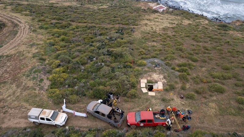 Rescue workers, forensics, and prosecutors preparing to enter a waterhole where human remains were found near La Bocana Beach