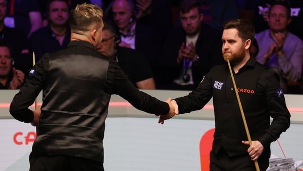 Jak Jones of Wales shakes hands with Kyren Wilson of England