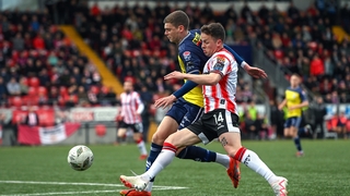 Shels' Sean Gannon (L) takes on Ben Doherty of Derry City