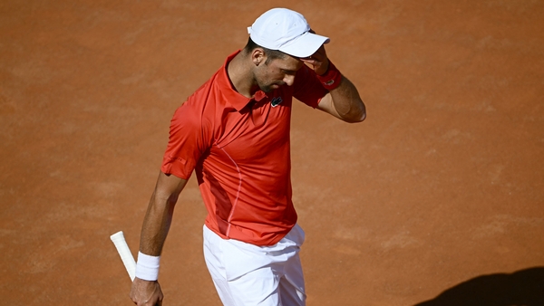 A dejected Djokovic reacts after being defeated by Chile's Alejandro Tabilo