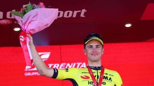 Olav Kooij celebrates on the podium