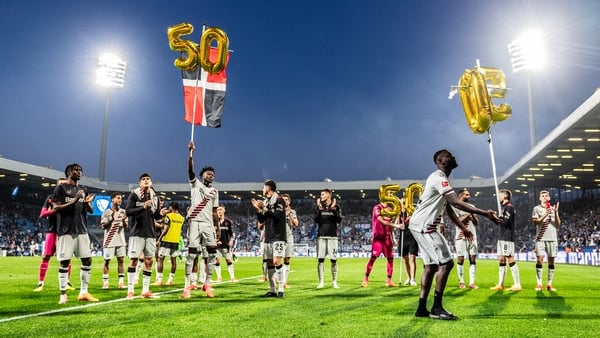 50 not out - Leverkusen players mark the occasion after their win at Bochum