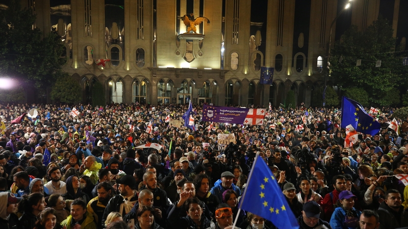 People gather in Tbilisi to stage a protest against the 'foreign influence' bill after it received government approval