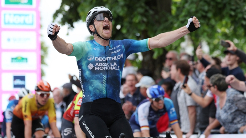 Bennett celebrates after crossing the line to win Stage Two in Dunkirk