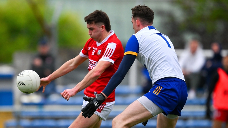 Cork's Chris Óg Jones (L) comes under pressure from Clare goalkeeper Stephen Ryan