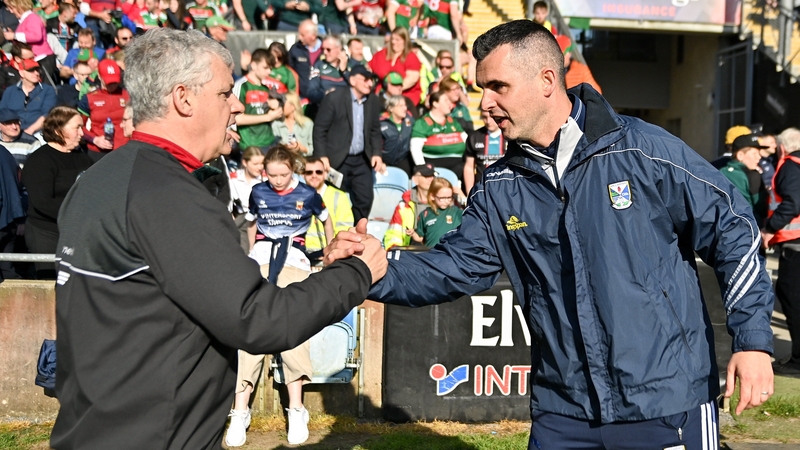 Mayo manager Kevin McStay and Cavan boss Raymond Galligan shake hands after the final whistle