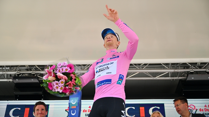 Sam Bennett celebrates on the podium as overall winner