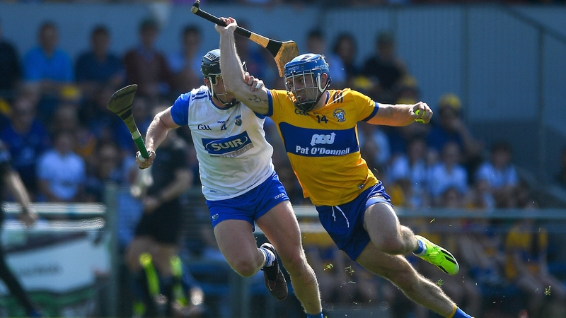 Clare's Shane O'Donnell takes on Waterford's Iarlaith Daly at Cusack Park